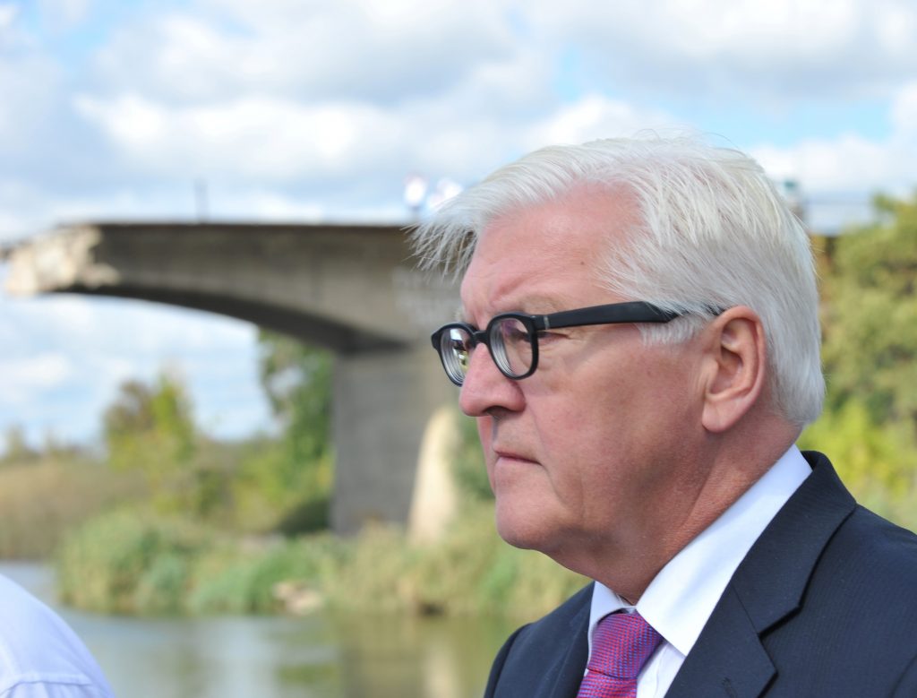German Foreign Minister Frank-Walter Steinmeier stands in front of a destroyed bridge during a visit with his French counterpart in Slavyansk, Donetsk region, Ukraine on Sept. 15, 2016. The German and French foreign ministers made their first visit to Ukraine's war-torn east since the beginning of the conflict between government forces and pro-Russian rebels in April 2014. SERGEY BOBOK/AFP/Getty Images